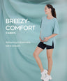 Pregnant woman wearing light blue Breezy-Comfort maternity t shirt with breathable, soft fabric and stretchy fit